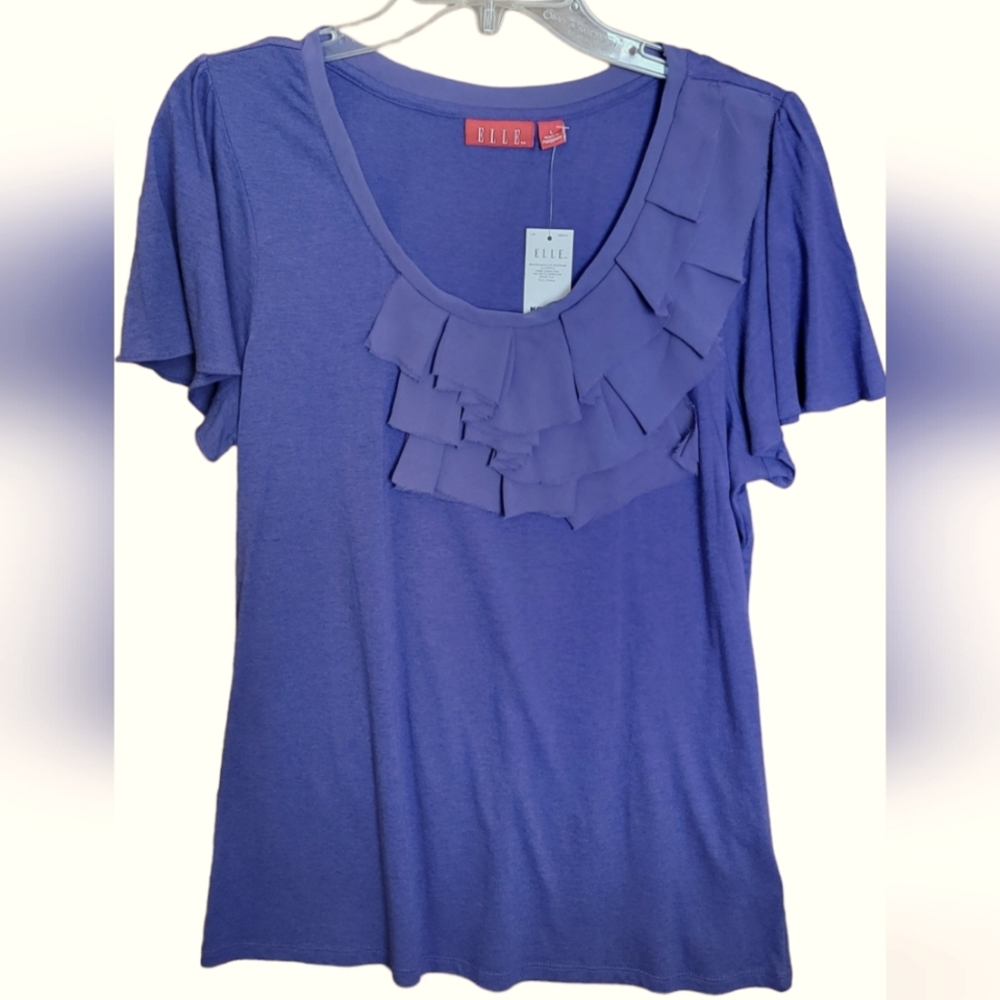 So pretty! Short sleeved jersey top in periwinkle with mesh front trim, size L.